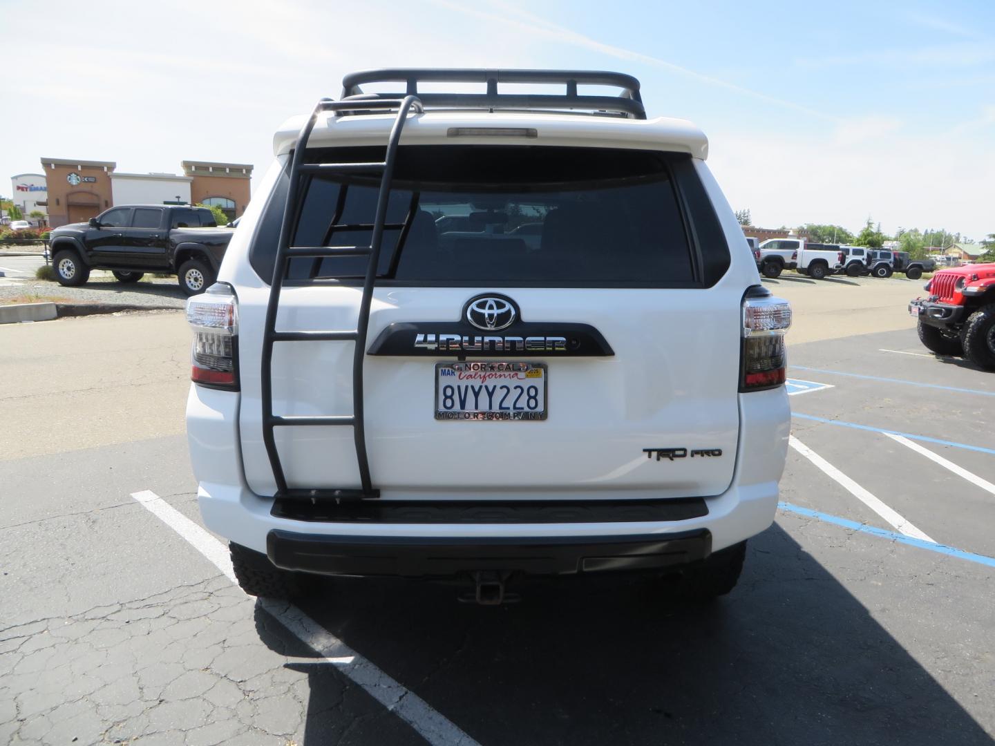 2019 White /black Toyota 4Runner TRD PRO 4WD (JTEBU5JR9K5) with an 4.0L V6 DOHC 24V engine, 5A transmission, located at 2630 Grass Valley Highway, Auburn, CA, 95603, (530) 508-5100, 38.937893, -121.095482 - TRD PRO 4Runner sitting on 17" SCS wheels, BFG KO2 tires, Tyger running boards, Roof Rack with ladder, and window tint. - Photo#5